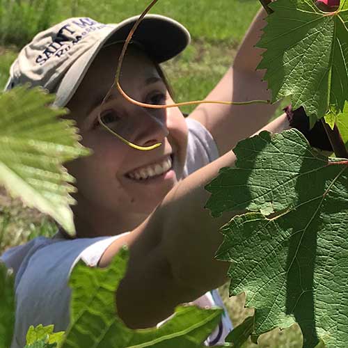 student in corn field