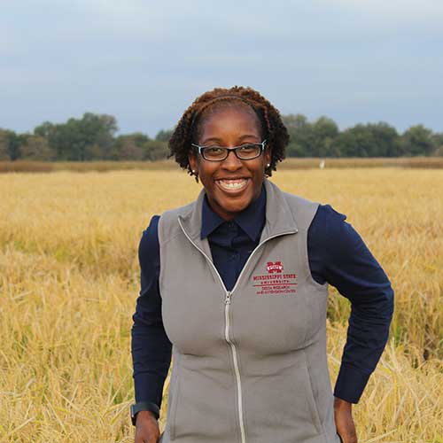 student in corn field