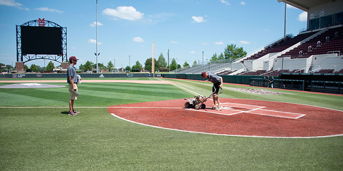 Students prepare baseball field