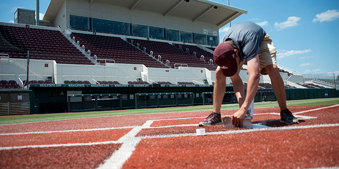 Student working on home plate