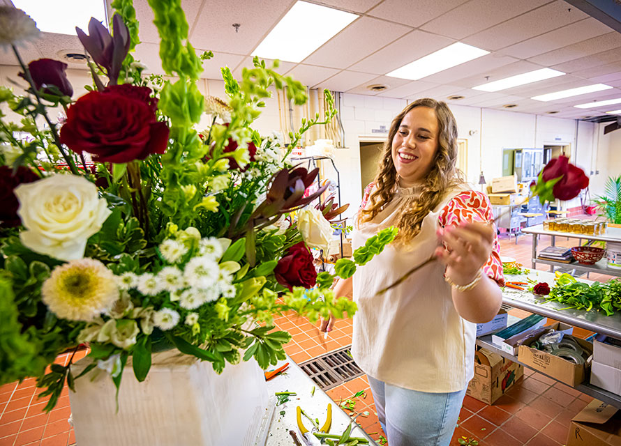 Florist preparing a flower arrangement